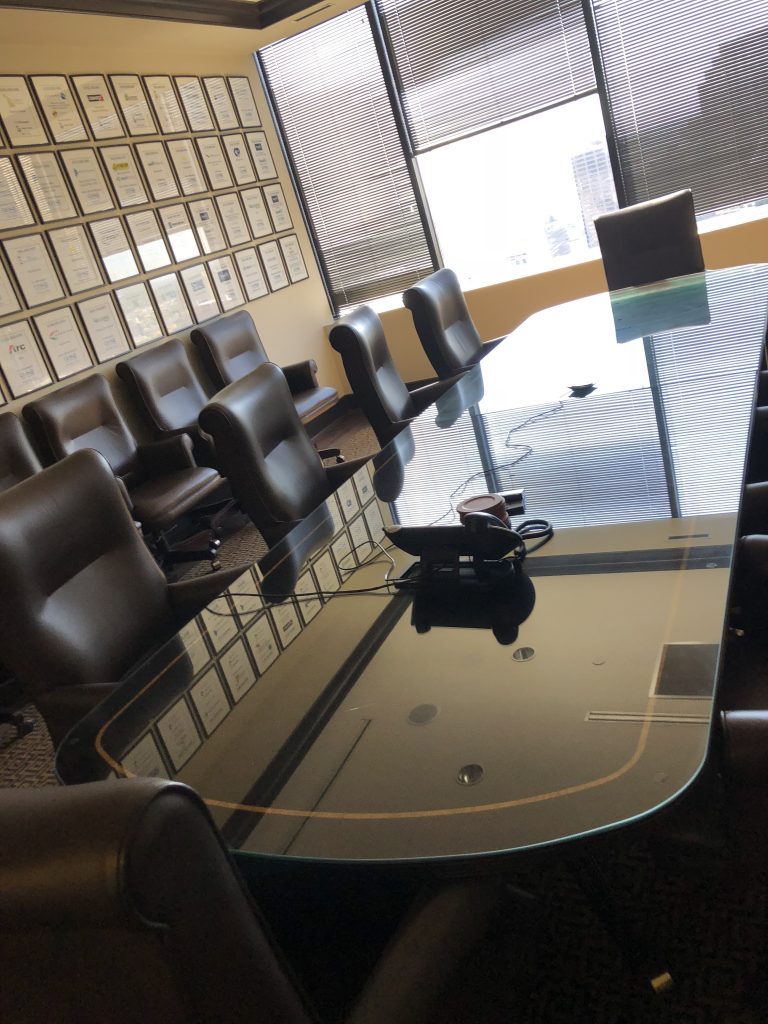 Custom glass table top protecting a wood dining table in a New Orleans home